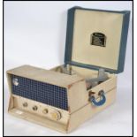 A 1960's portable Emerson Hi Fidelity  four speed two tone record player. Hinged lid lifting to