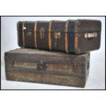 2 vintage steamer trunks from the early 20th century to include wooden bound canvas steamer trunk