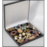 a collection of vintage and contemporary costume jewellery brooches and clip on earrings, to include