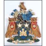 A 20th century large armorial crest / coat of arms for Leeds Permanent Building Society having motto