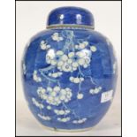 A Chinese blue and white porcelain ginger jar late 19th / early 20th Century decorated with prunus