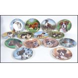 A collection of fourteen  collectors plates from Danbury Mint depicting Boxer dogs.