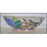 A believed 19th century Chinese ceramic famille rose bowl with handpainted decoration being signed