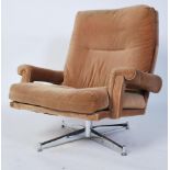 An original retro mid century swivel chair by Howard Keith for HK Furniture of London. Raised on a