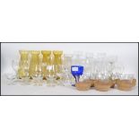 A collection of mixed glass ware to include a set of six toddy / hot punch glasses with wooden