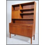 A 1970's McIntosh of Kirkcaldy teak wood sideboard room divider cabinet having a shaped cabinet with