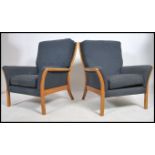 A pair of retro 20th century Parker Knoll armchairs. Measures 80cm high x 77cm wide x 80cm deep.