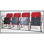 A set of 4 - run of 4 retro 20th century folding cinema chairs upholstered in red moquette fabric