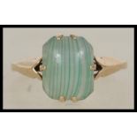 A ladies 9ct gold single stone dress ring with unusual agate stone centre of lined form, the shank