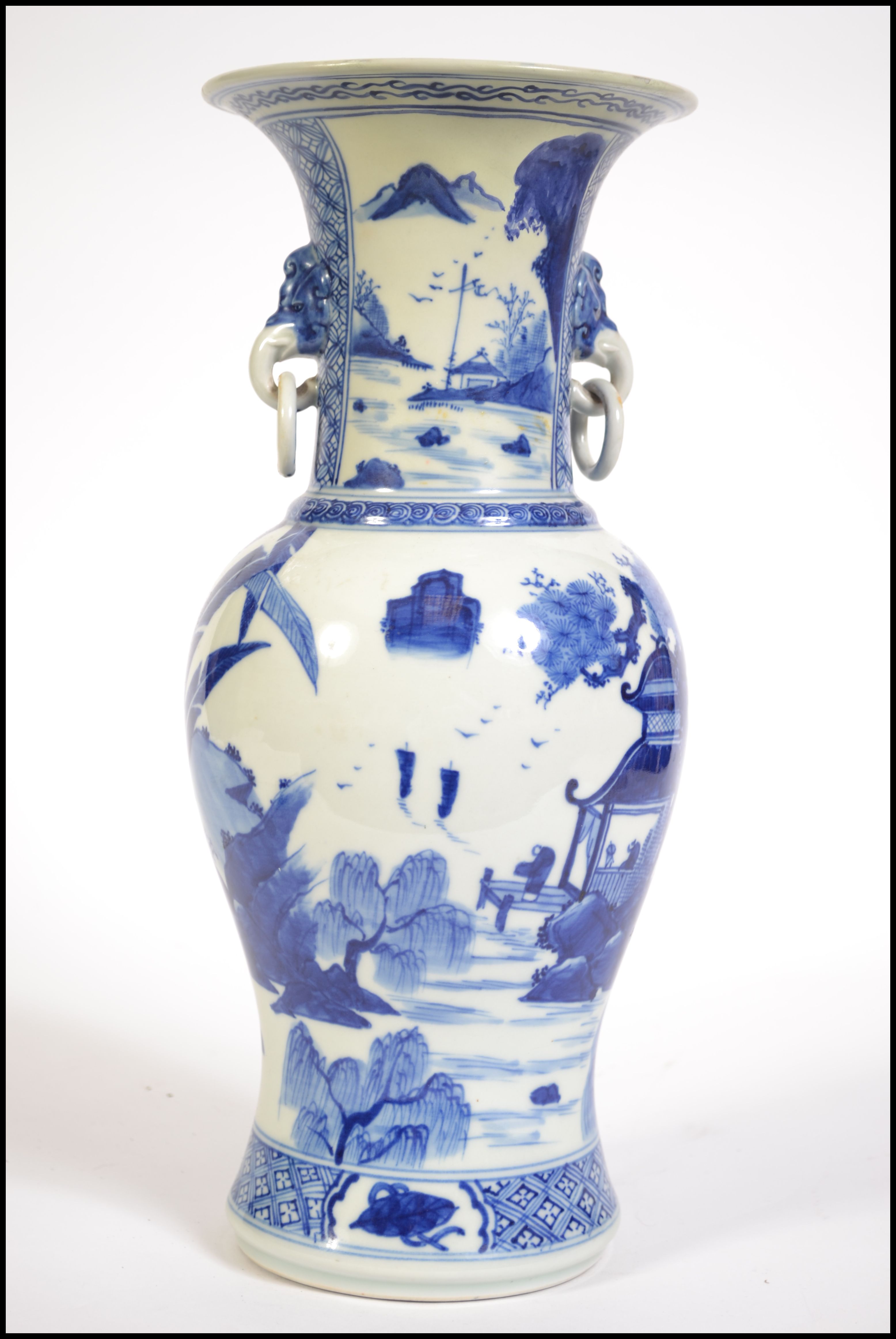 A Chinese blue and white Kang-xi type twin handled gu vase having ring handles with elephant mask