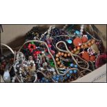 A collection of vintage and contemporary costume jewellery to include beaded necklaces, bracelets