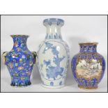 A group of three large Chinese vases of varying design to include famille blue with pictorial