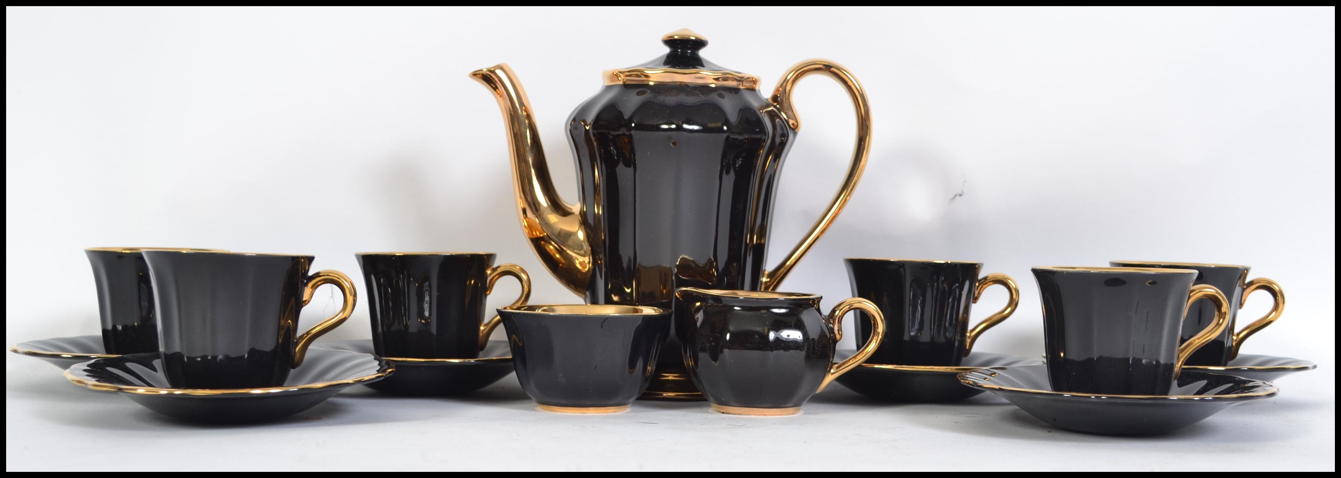 A vintage boxed 20th century coffee service by Wade, looks to be unused in the original box, black