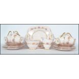 A stunning early 20th century Bone China Plant Tuscan tea service, consisting of six cups and