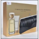 A cased 20th century unused Caroline Herrara ( New York ) perfume - body lotion and handbag set