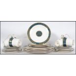 A Royal Doulton part dinner service in the Carlyle pattern, consisting of dinner plates, side plates