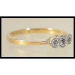 An 18ct gold and platinum 3 stone diamond ring eac