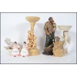 A collection of ceramic figurines to include cheru