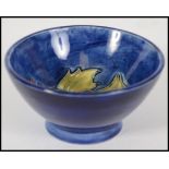 A Moorcroft bowl of small proportions in the Pansy