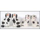 Two pairs of good black and white Staffordshire po