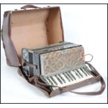 A vintage Italian Casali Verona piano accordion being twin octave with mother of pearl inlay being