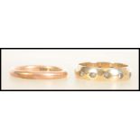 A marked 9ct gold wedding band along with a 9ct gold eternity ring. Approx. 5.6g