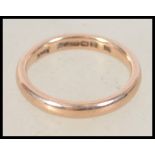 A hallmarked 9ct gold band ring bearing Birmingham