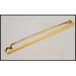 A 9ct gold gentlemens tie clip with safety catch complete in original retailers box. Weighs 0.9