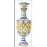 An unusual Faience continental glazed vase of tall