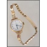 A 9ct gold ladies dress / cocktail watch by Record