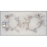 2 silver charm bracelets with many silver charms including some very unusual pieces.