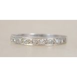 An 18ct white gold and diamond ladies half eternit