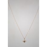 A ladies vintage 9ct gold pendant and necklace chain. Central stone with diamond surrounds. Total