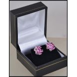 A pair of ladies silver and pink sapphire type sto