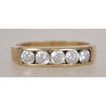 A 9ct gold 5 stone diamond ring being channel set