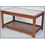A 1970's teak and twin tile coffee table. The dark