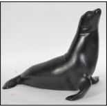 A Royal Dux figure of a seal with pink triangle br