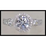 A ladies silver and cz adorned dress ring in the f