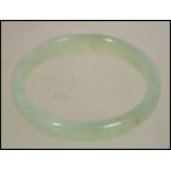 A 20th century Chinese ladies Jade bangle of round