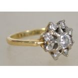 An 18ct gold and diamond ring having starburst mou