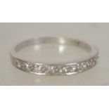 An 18ct white gold and diamond ladies half eternit