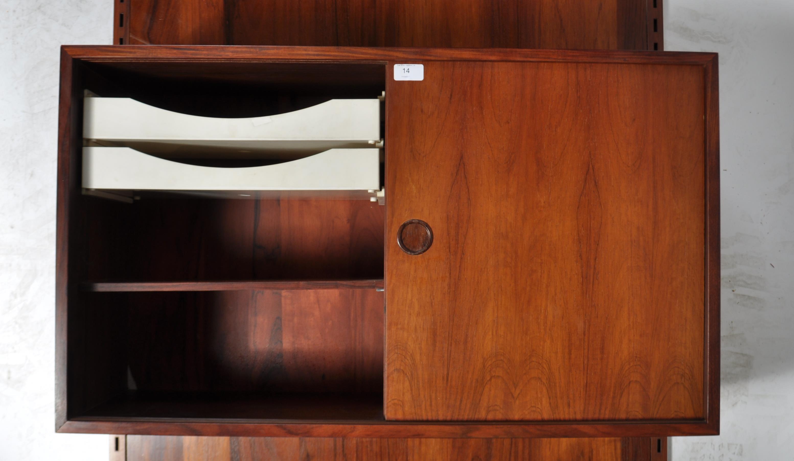 A rare mid century Danish rosewood modular wall system having a large rosewood panel back with - Image 10 of 10