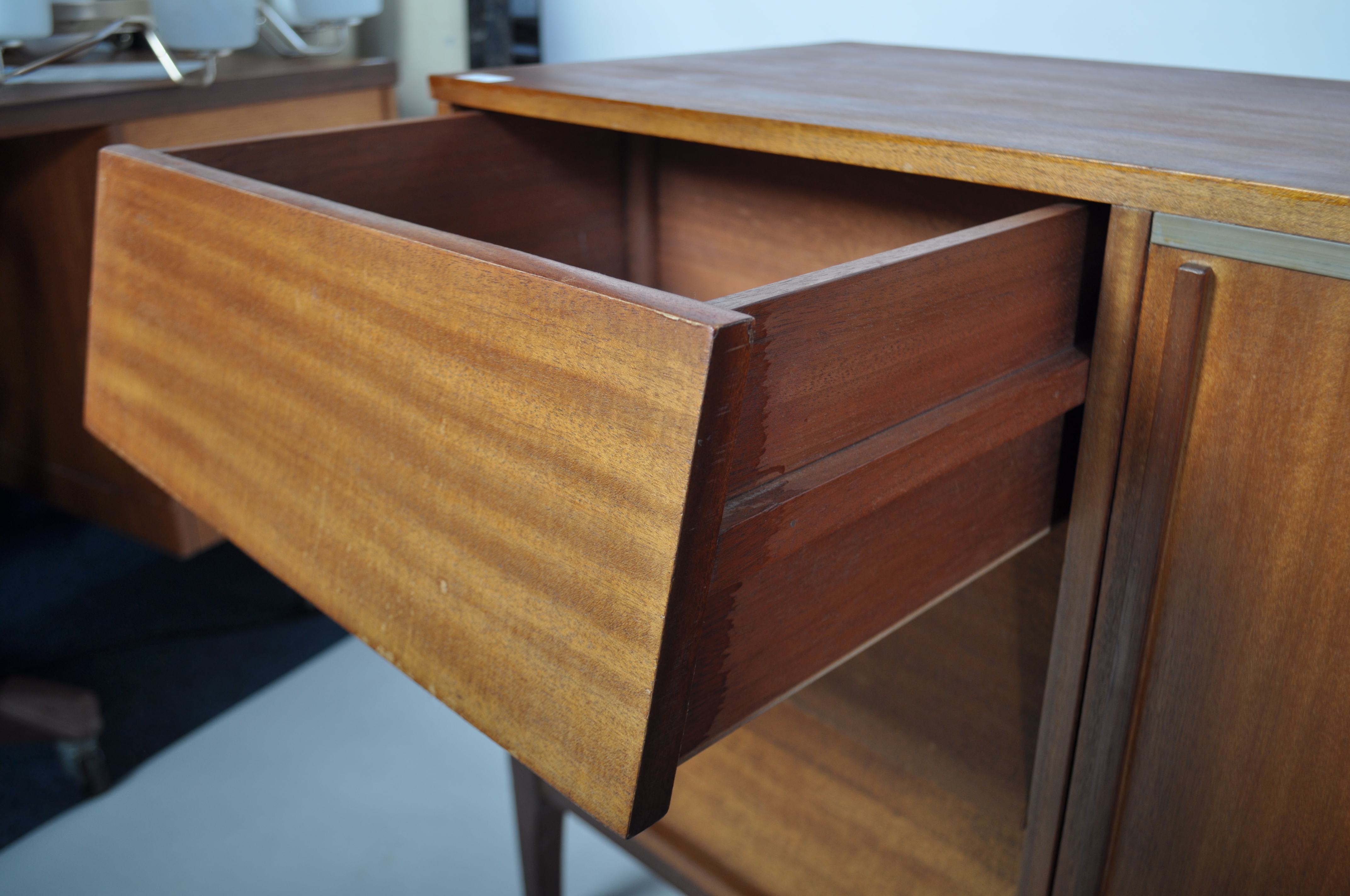 A retro mid century teak wood sideboard having a beehive angular facia comprising a series of - Image 4 of 5