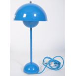 A contemporary flowerpot desk lamp in blue by Louis Poulsen for Verner Panton. Domed half spheres in