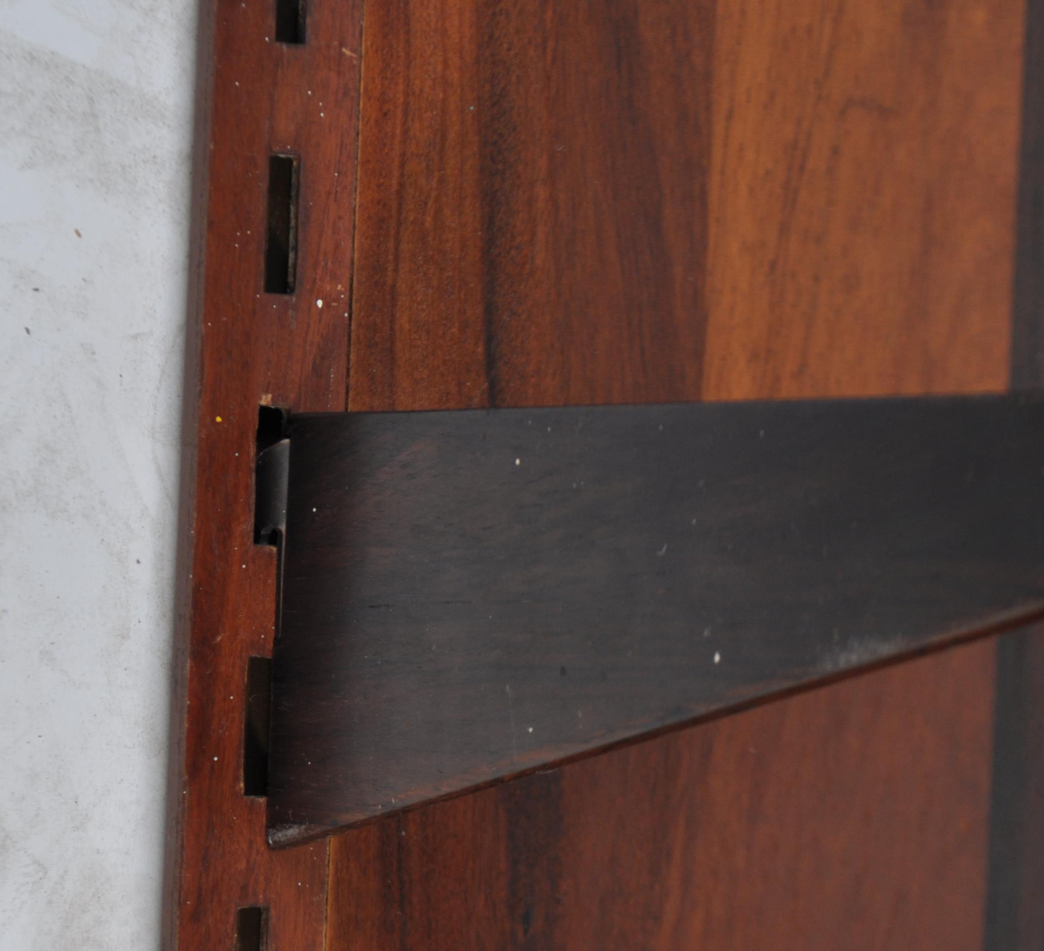 A rare mid century Danish rosewood modular wall system having a large rosewood panel back with - Image 9 of 10