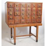An early to mid  20th century oak Air Ministry Industrial filing cabinet of thirty library index