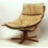 A scandinavian leather and bentwood ' falcon ' style  armchair by Stouby. Raised on multiple splayed