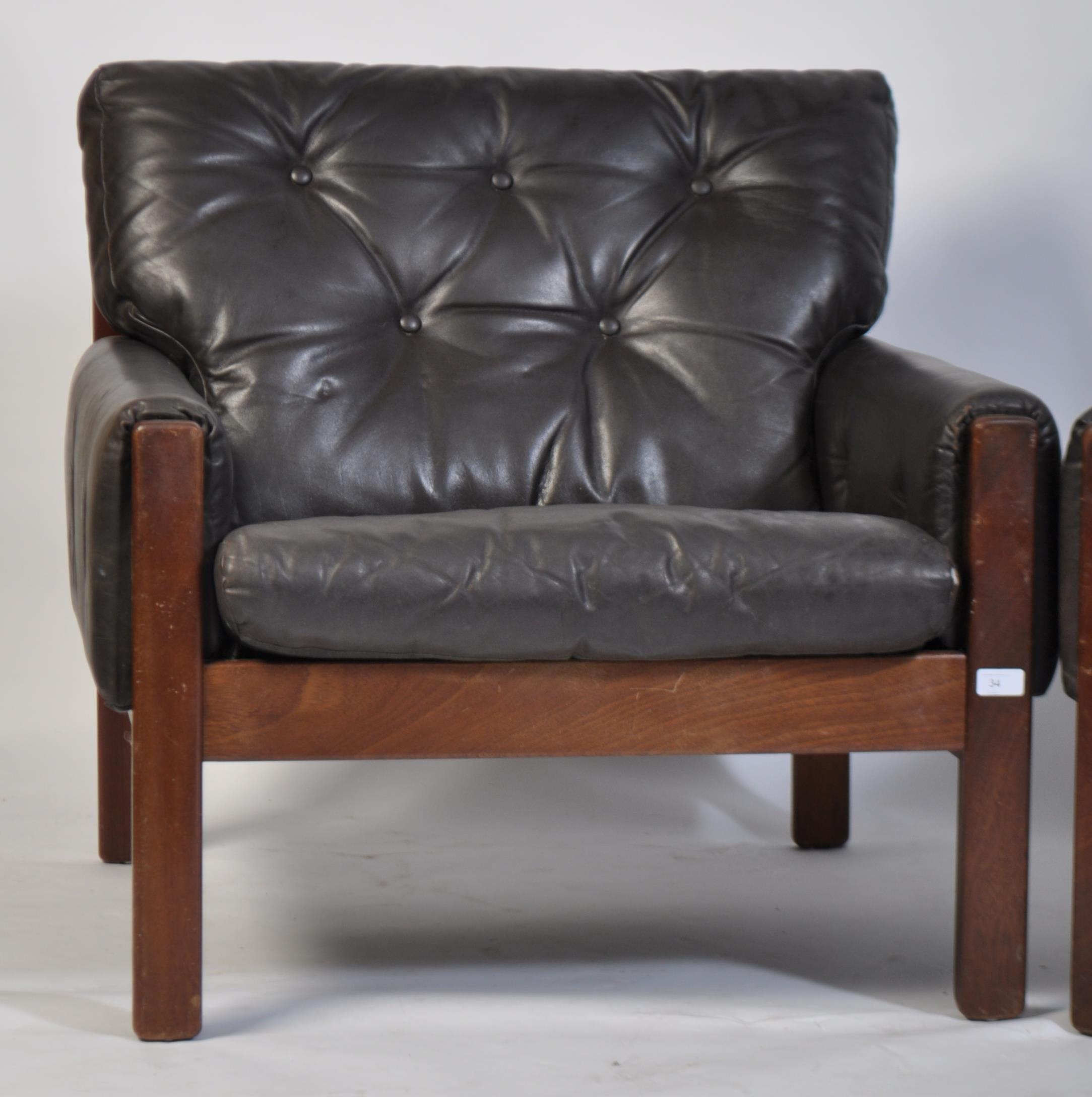 A stunning pair of 1960's teak and leather Danish armchairs. The black leather cushions being button - Image 2 of 4