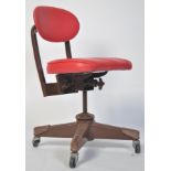 A vintage 20th century industrial swivel machinist chair. Raised on four painted  metal tubular