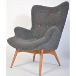 After Finn Juhl, a stunning armchair being raised on tapering turned legs with grey fabric